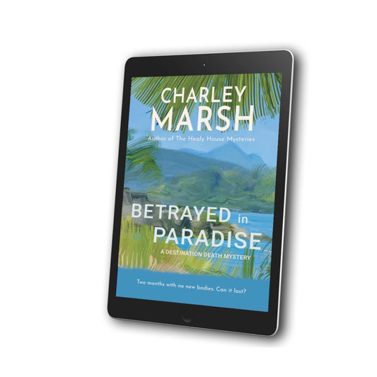 A tablet device displaying the book cover of 'Betrayed in Paradise' by Charley Marsh, shown at an angle on a clean white background.